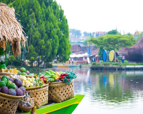 Local Indonesian open air market with stalls containing vibrant fresh tropical fruits
